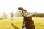 back-view-male-golfer-swinging-golf-club